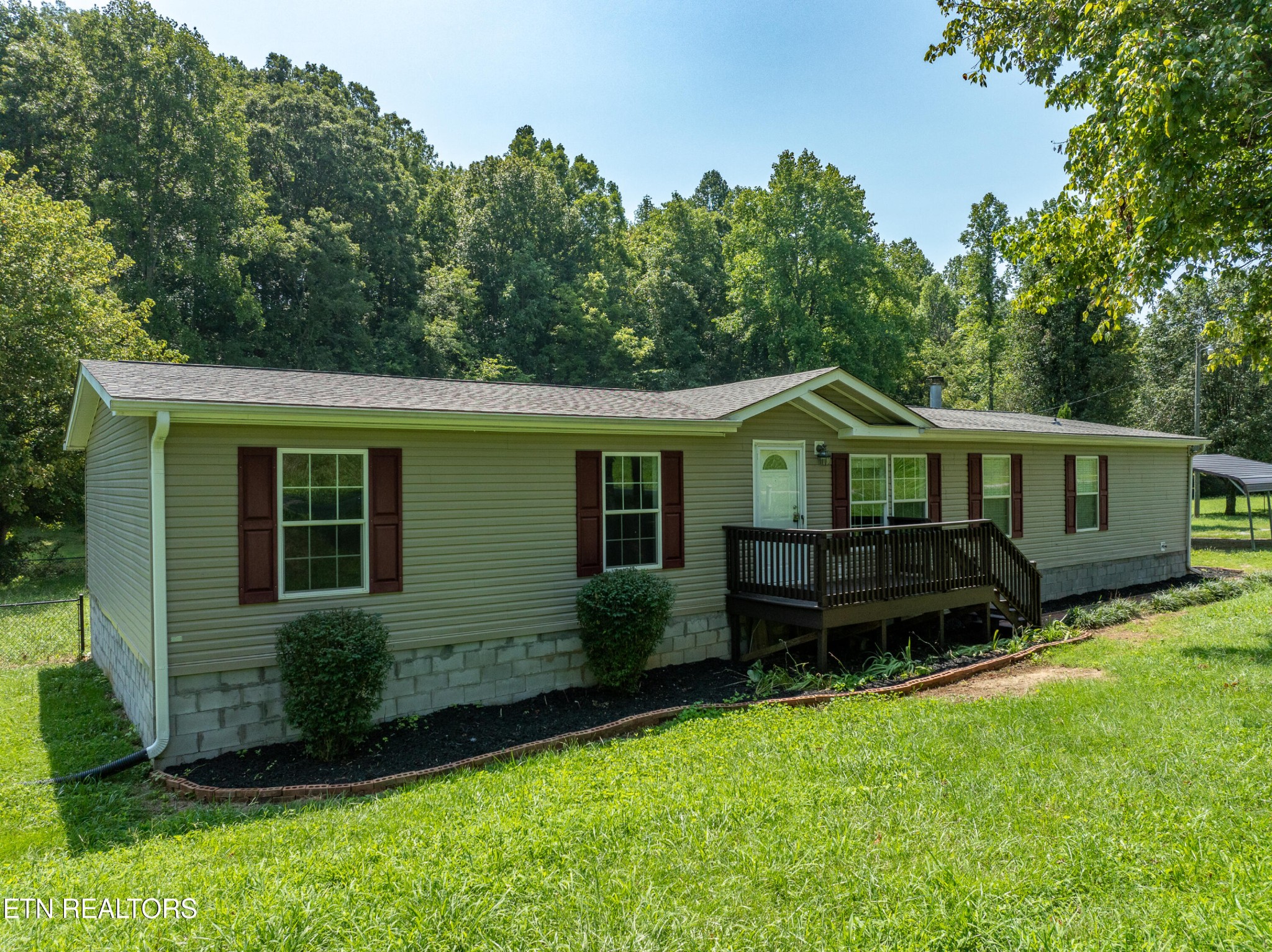135 Crowder Road Madisonville, TN 37354 - Photo 1 of 39 a front view of a house with a yard