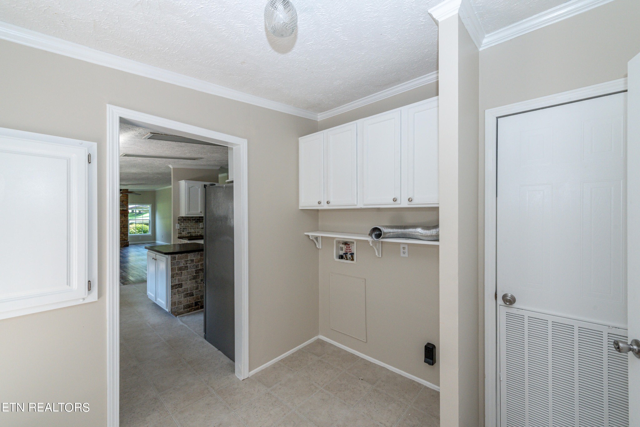 135 Crowder Road Madisonville, TN 37354 - Photo 16 of 39 a view of a kitchen from a hallway