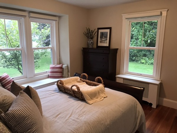 44 Prospect Street Acton, MA 01720 - Photo 13 of 25 a bedroom with a bed and a window