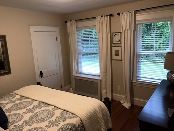 44 Prospect Street Acton, MA 01720 - Photo 15 of 25 a bedroom with a bed next to a window