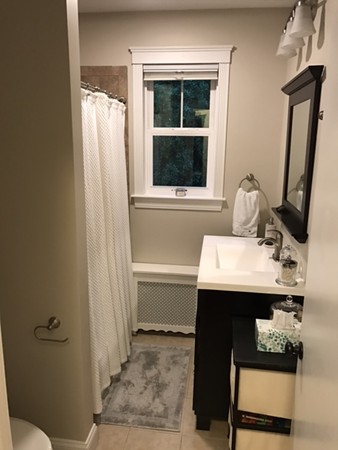44 Prospect Street Acton, MA 01720 - Photo 19 of 25 a bathroom with a sink and a mirror
