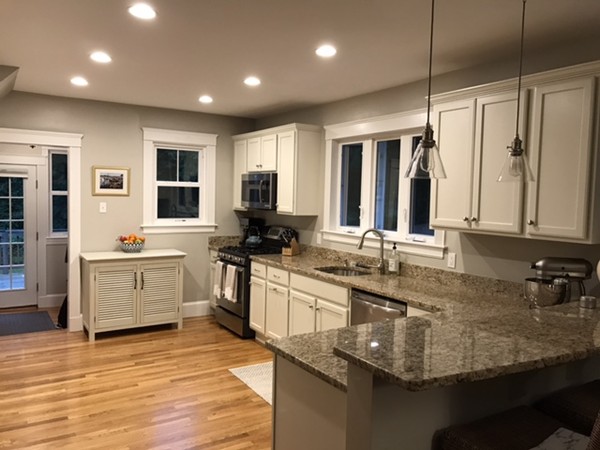 44 Prospect Street Acton, MA 01720 - Photo 4 of 25 a large kitchen with granite countertop a sink counter top space appliances and cabinets