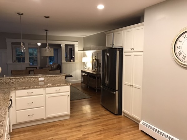 44 Prospect Street Acton, MA 01720 - Photo 5 of 25 a kitchen with granite countertop a refrigerator and a sink
