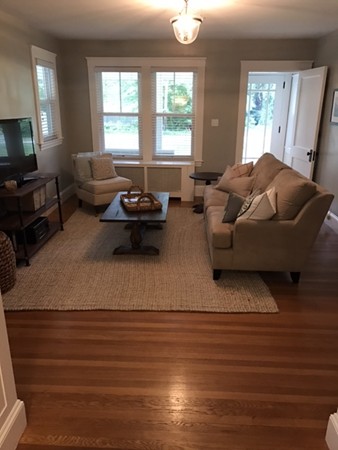 44 Prospect Street Acton, MA 01720 - Photo 9 of 25 a living room with furniture window and a wooden floor
