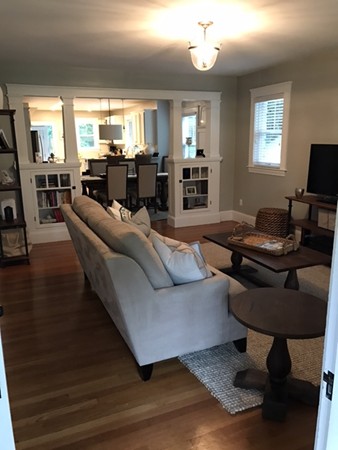 44 Prospect Street Acton, MA 01720 - Photo 10 of 25 a living room with furniture or couch and a flat screen tv