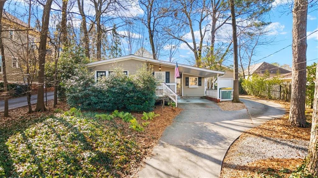 109 Spruell Springs Road Atlanta, GA 30342 - Photo 1 of 34 a front view of a house with a yard and fountain