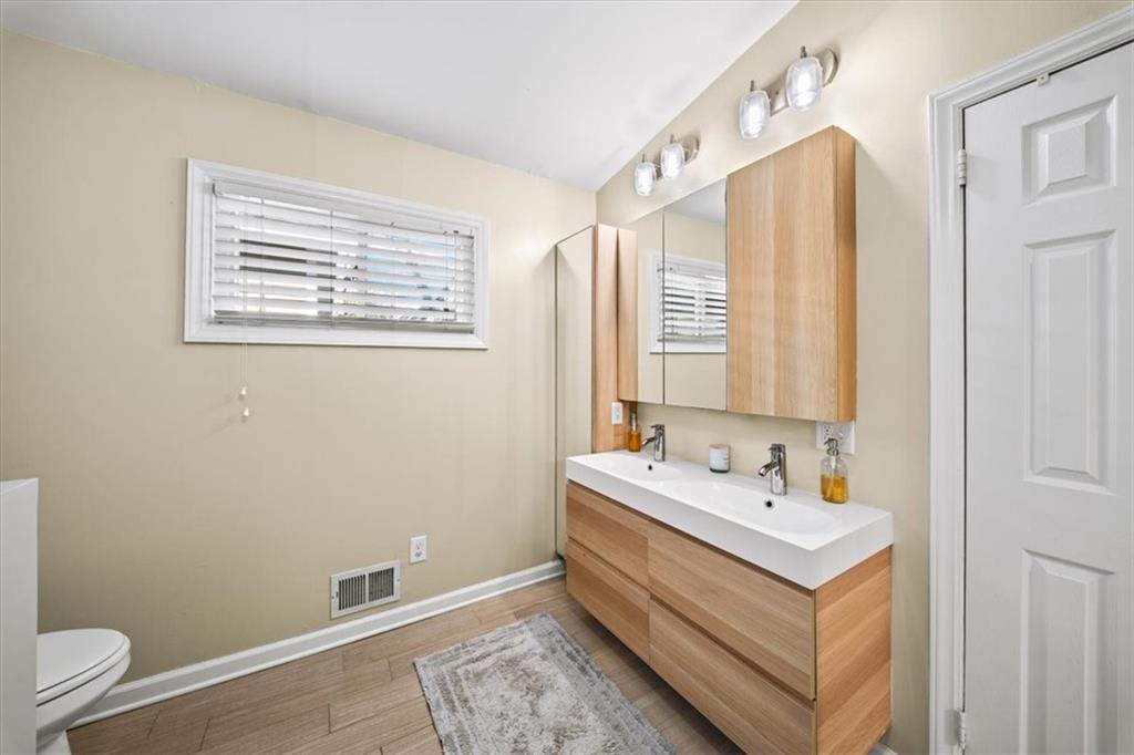 109 Spruell Springs Road Atlanta, GA 30342 - Photo 15 of 34 a bathroom with a sink tub and a window
