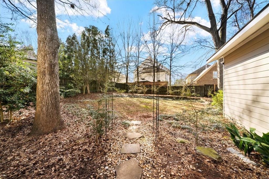 109 Spruell Springs Road Atlanta, GA 30342 - Photo 31 of 34 a view of a yard with trees