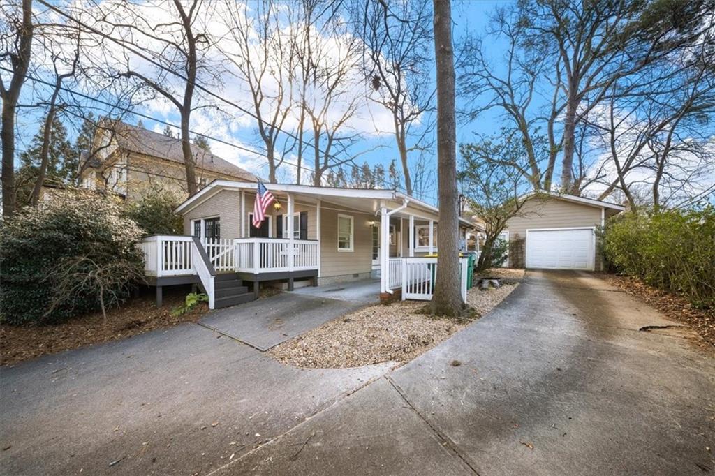 109 Spruell Springs Road Atlanta, GA 30342 - Photo 33 of 34 a view of a house with a yard and large tree