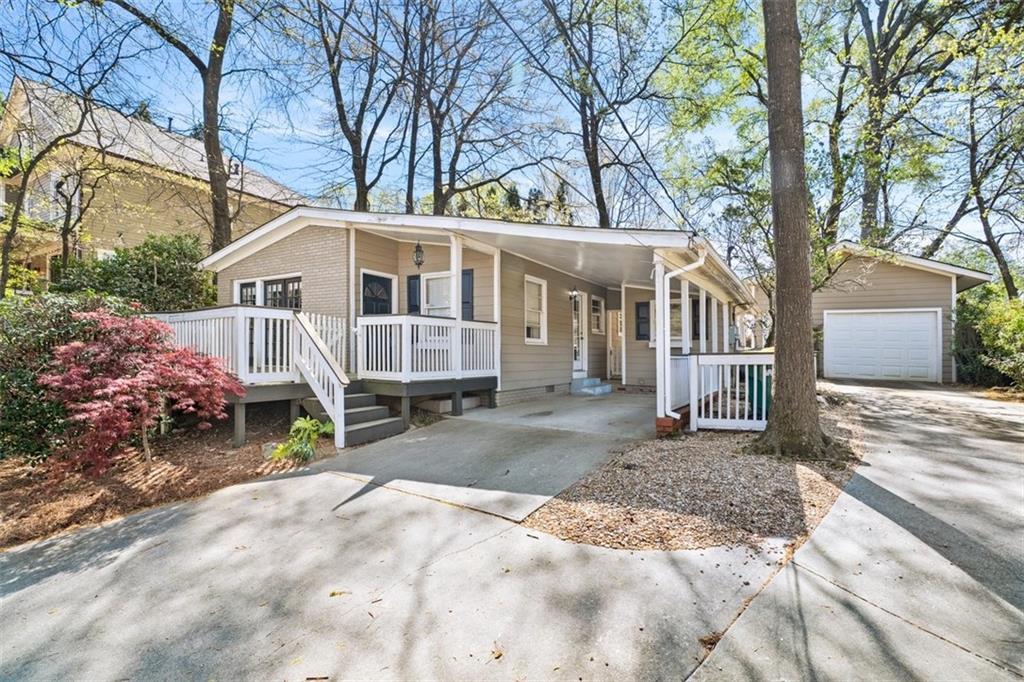 109 Spruell Springs Road Atlanta, GA 30342 - Photo 34 of 34 a view of a house with a yard covered with trees and buildings