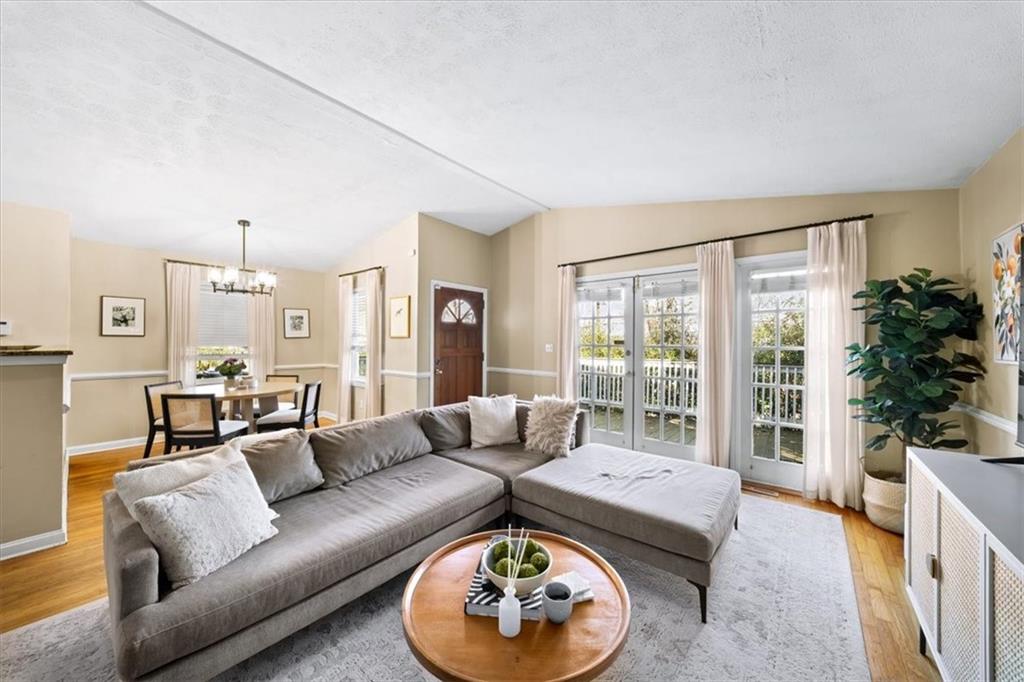 109 Spruell Springs Road Atlanta, GA 30342 - Photo 5 of 34 a living room with furniture and a large window