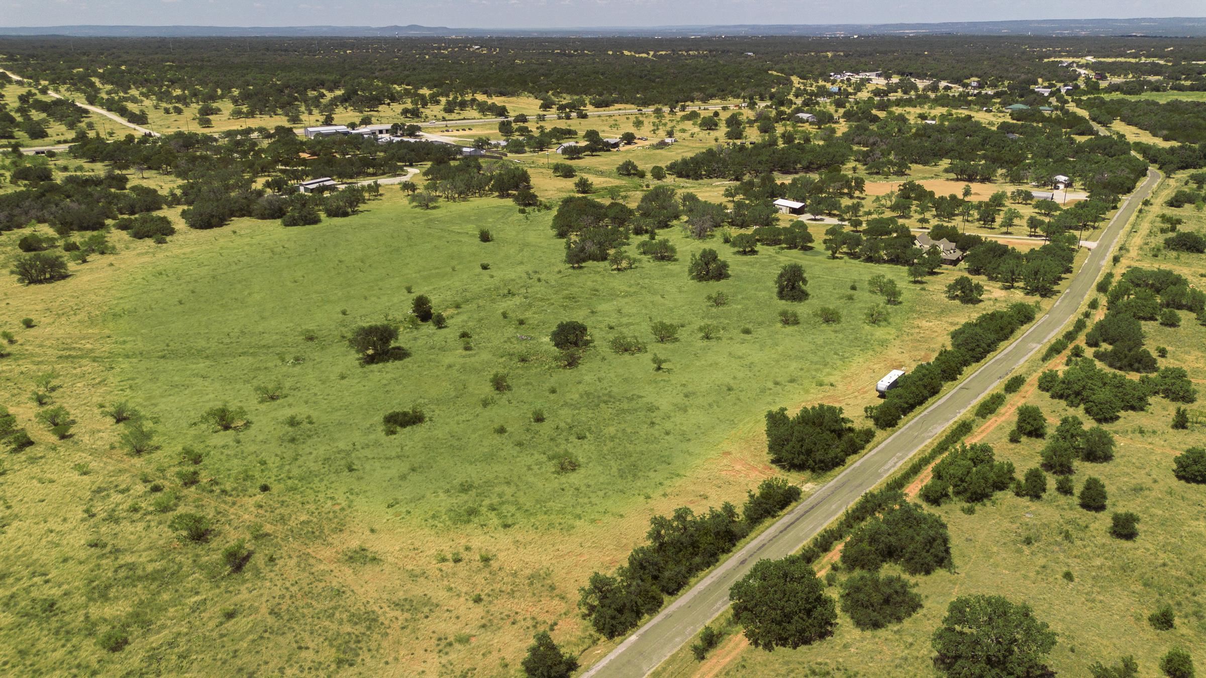 2965 Old Marble Falls Road Round Mountain, TX 78663 - Photo 11 of 28 a view of a city with an ocean view