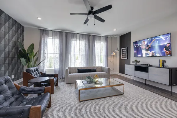 a living room with furniture and kitchen view