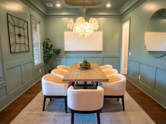 a living room with furniture and a view of kitchen