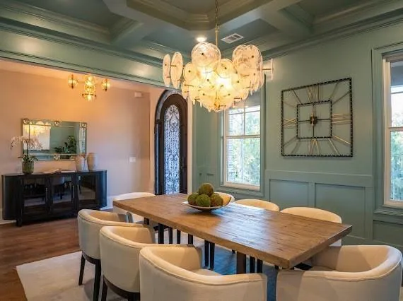 a large kitchen with a table and chairs