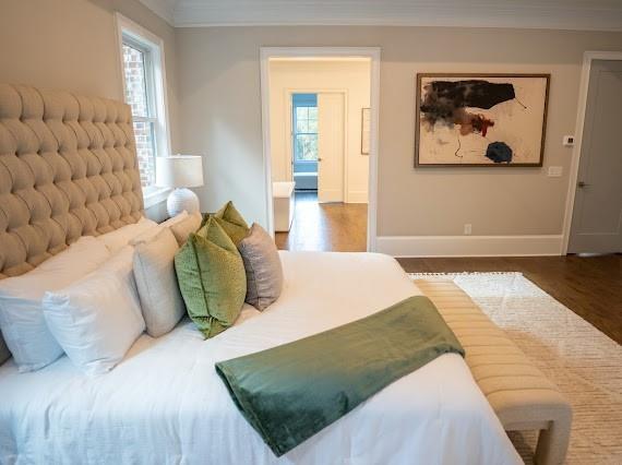 Undisclosed Address Athens, GA 30607 - Photo 30 of 85 a bedroom with a bed and a painting on the wall