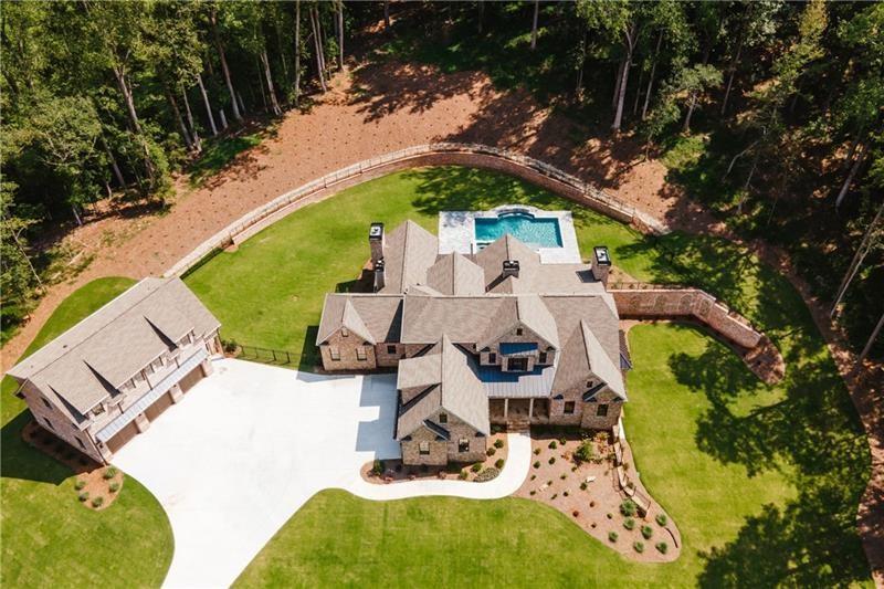 Undisclosed Address Athens, GA 30607 - Photo 4 of 85 an aerial view of a house with swimming pool and large trees