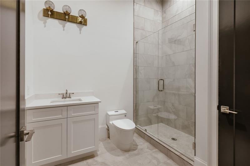 Undisclosed Address Athens, GA 30607 - Photo 43 of 85 a bathroom with a shower toilet and sink