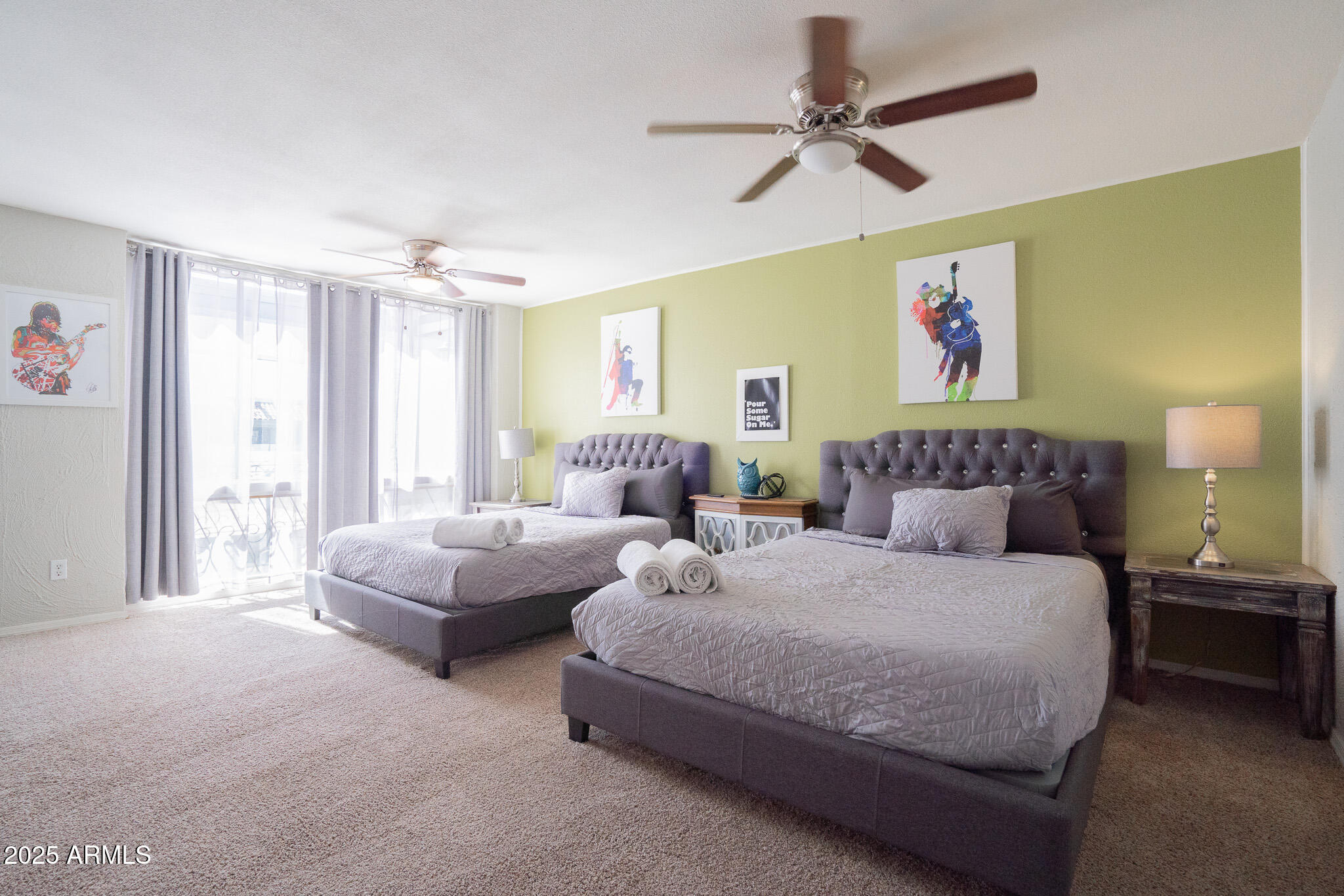 3314 North 68th Street, Unit 201 Scottsdale, AZ 85251 - Photo 19 of 29 a spacious bedroom with two beds and a chandelier