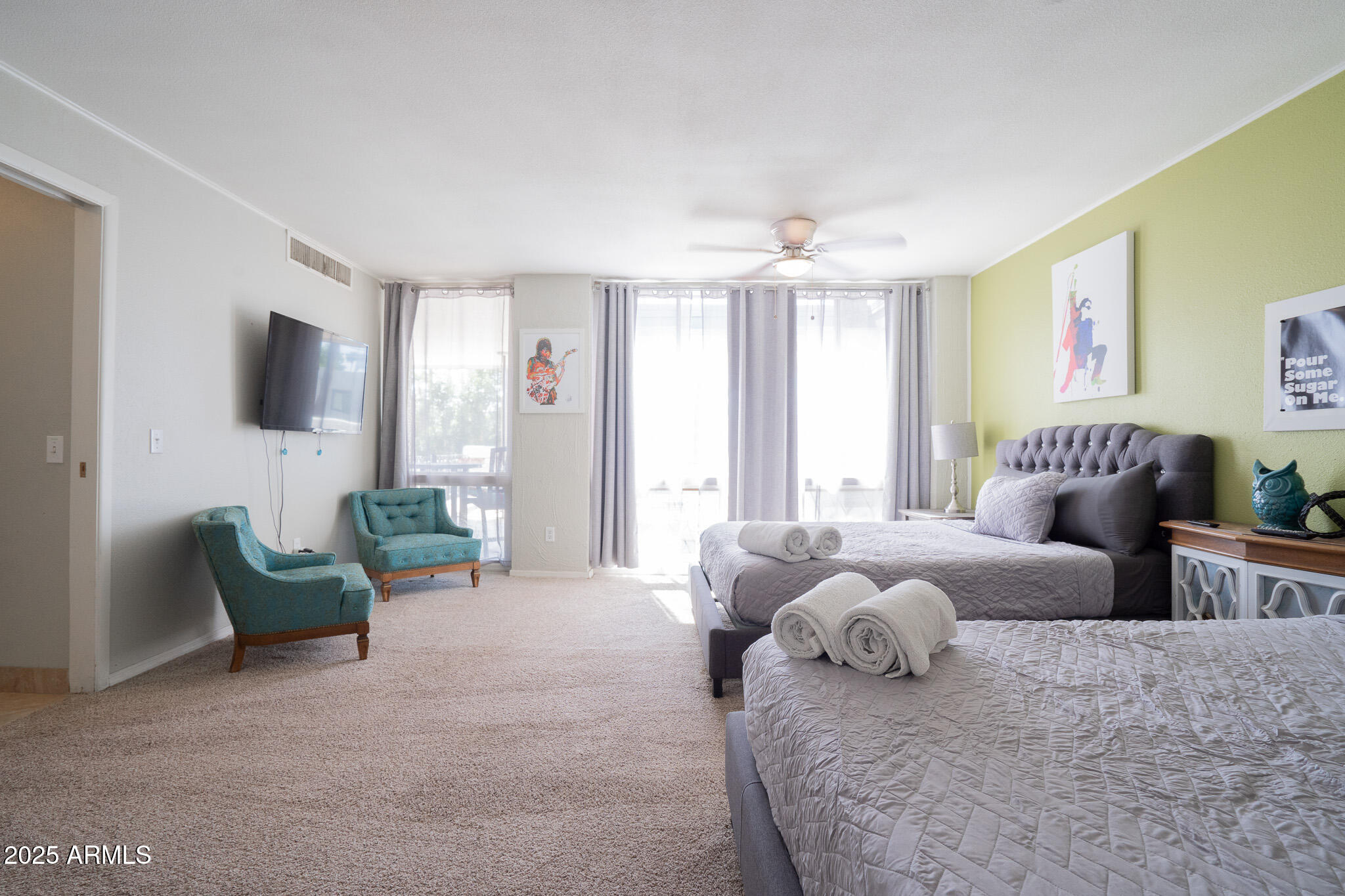 3314 North 68th Street, Unit 201 Scottsdale, AZ 85251 - Photo 20 of 29 a bedroom with furniture and a flat screen tv