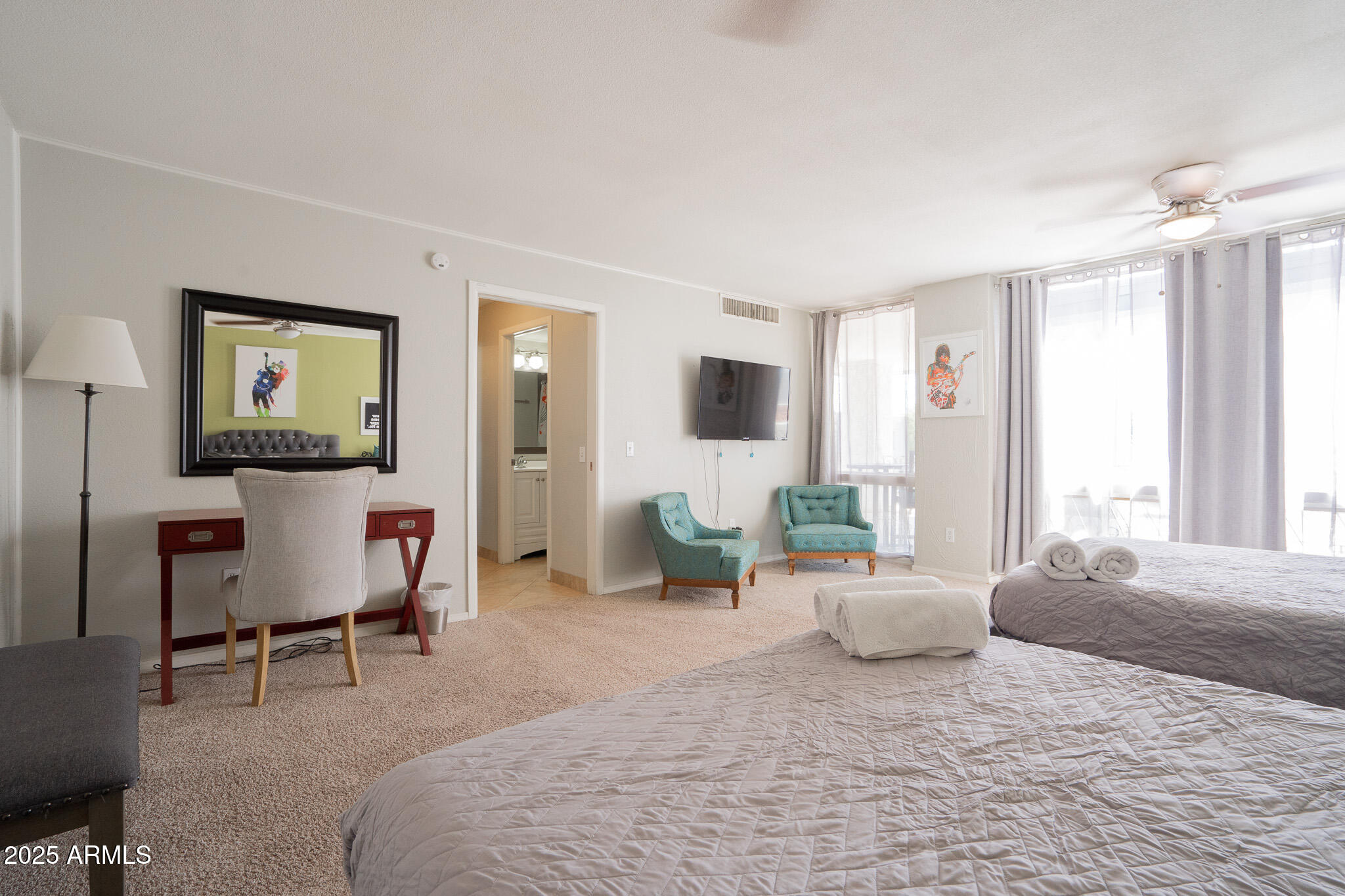 3314 North 68th Street, Unit 201 Scottsdale, AZ 85251 - Photo 21 of 29 a bedroom with furniture and a large window