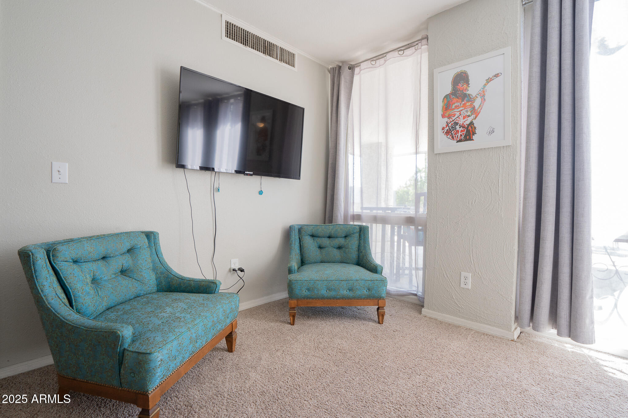 3314 North 68th Street, Unit 201 Scottsdale, AZ 85251 - Photo 22 of 29 a living room with furniture and a window