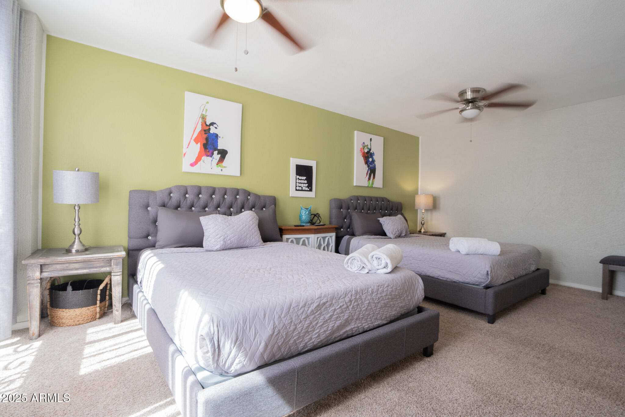 3314 North 68th Street, Unit 201 Scottsdale, AZ 85251 - Photo 23 of 29 a bedroom with a bed and a chandelier