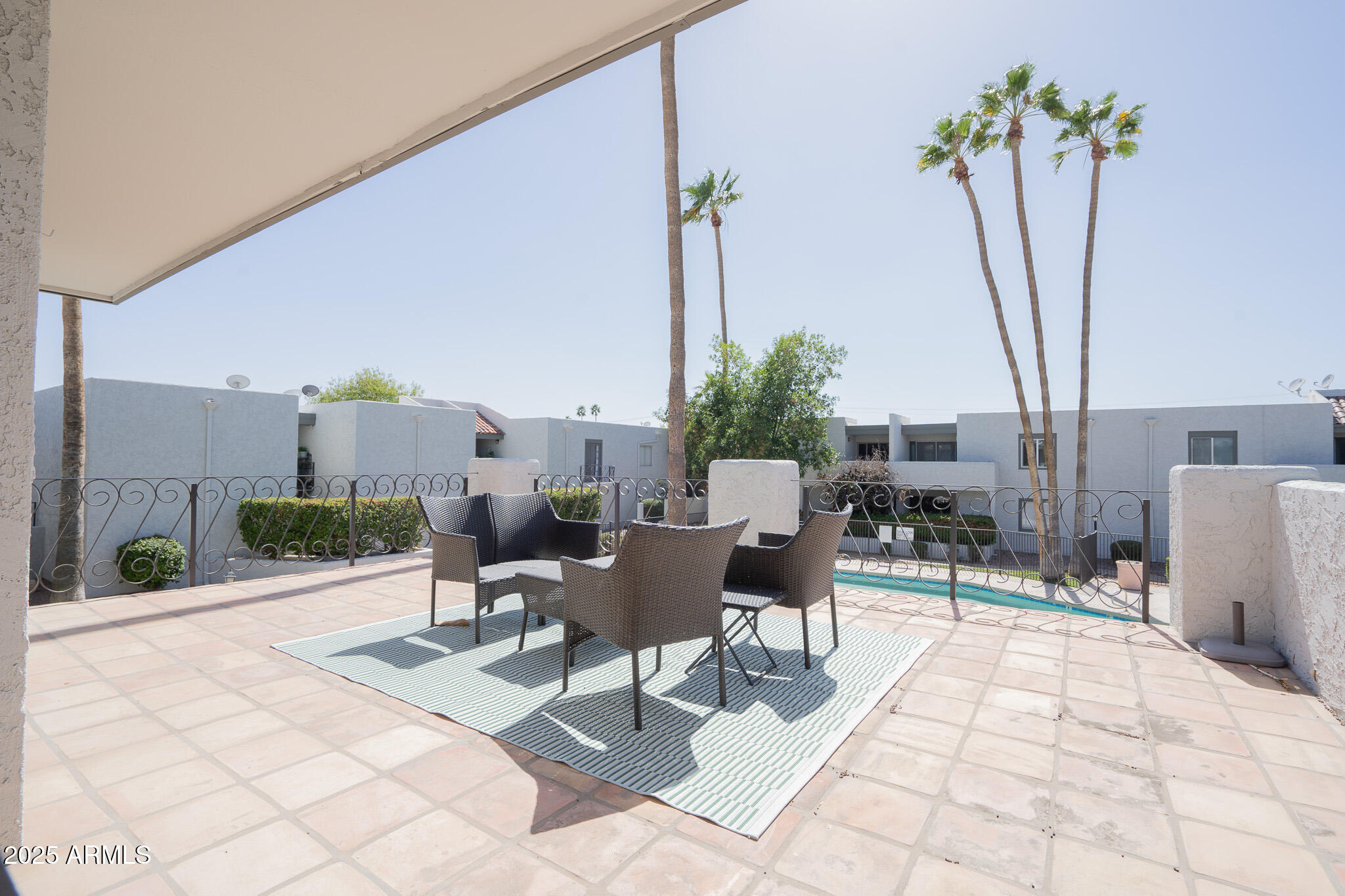3314 North 68th Street, Unit 201 Scottsdale, AZ 85251 - Photo 25 of 29 a outdoor space with lots of tables a chair and a potted plant