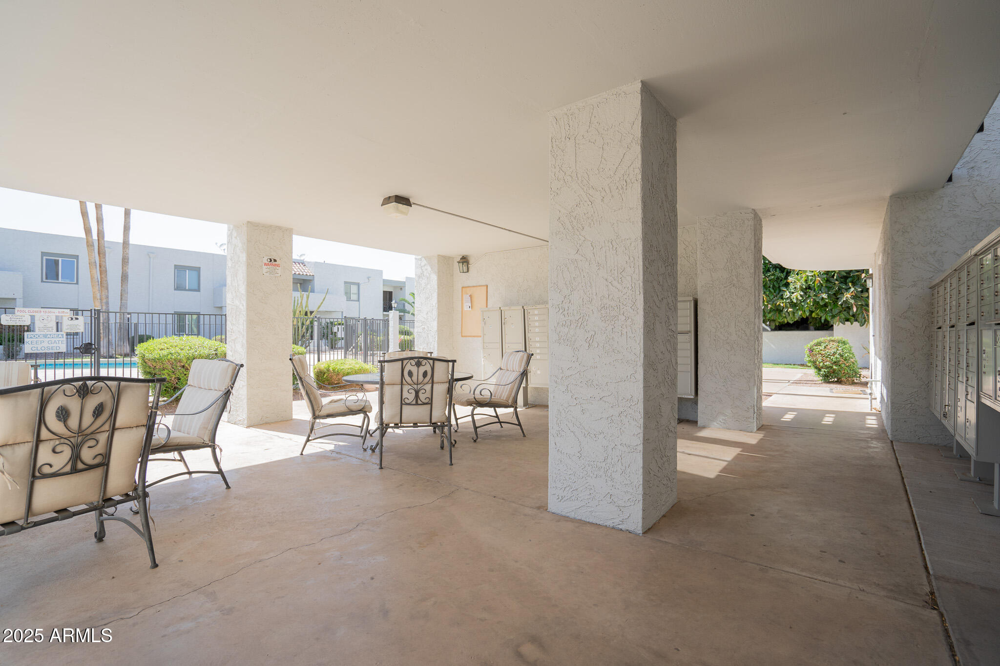 3314 North 68th Street, Unit 201 Scottsdale, AZ 85251 - Photo 29 of 29 a living room with furniture and a table