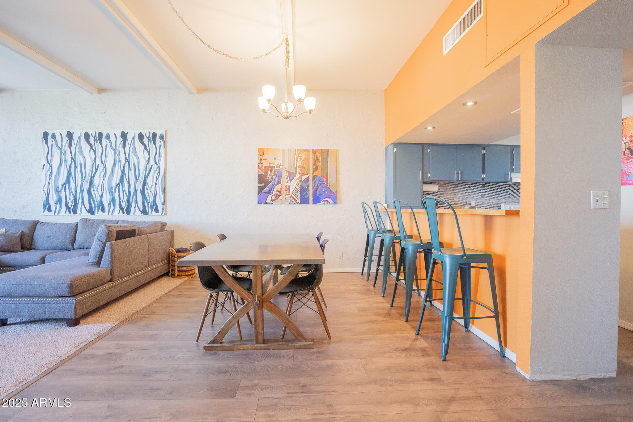 3314 North 68th Street, Unit 201 Scottsdale, AZ 85251 - Photo 5 of 29 a living room with furniture a dining table and chairs with wooden floor