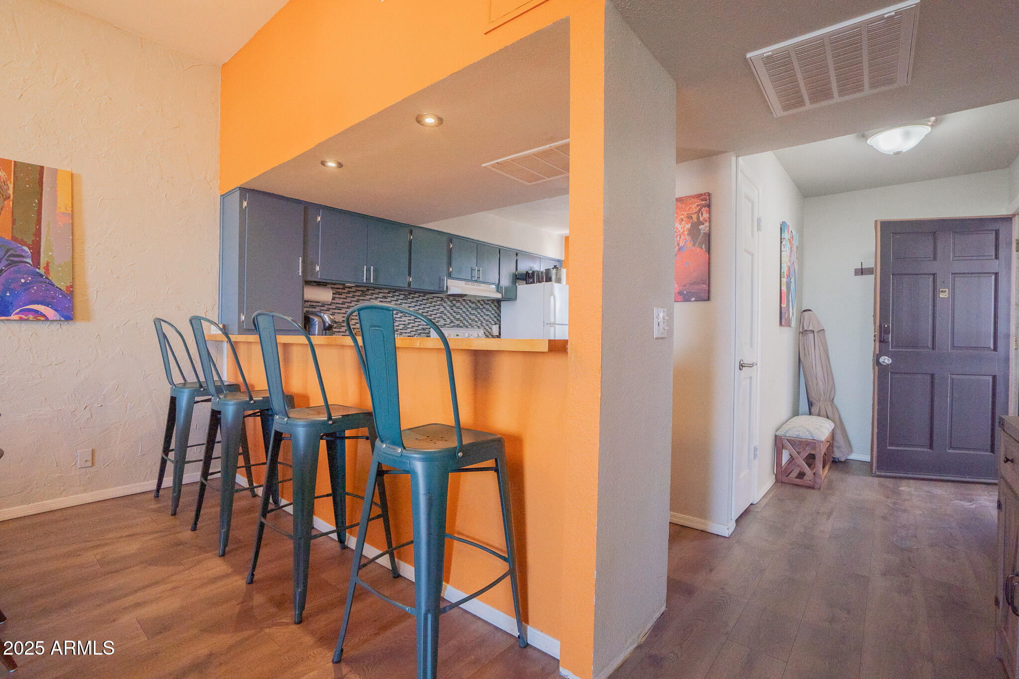 3314 North 68th Street, Unit 201 Scottsdale, AZ 85251 - Photo 6 of 29 a view of an empty room and wooden floor
