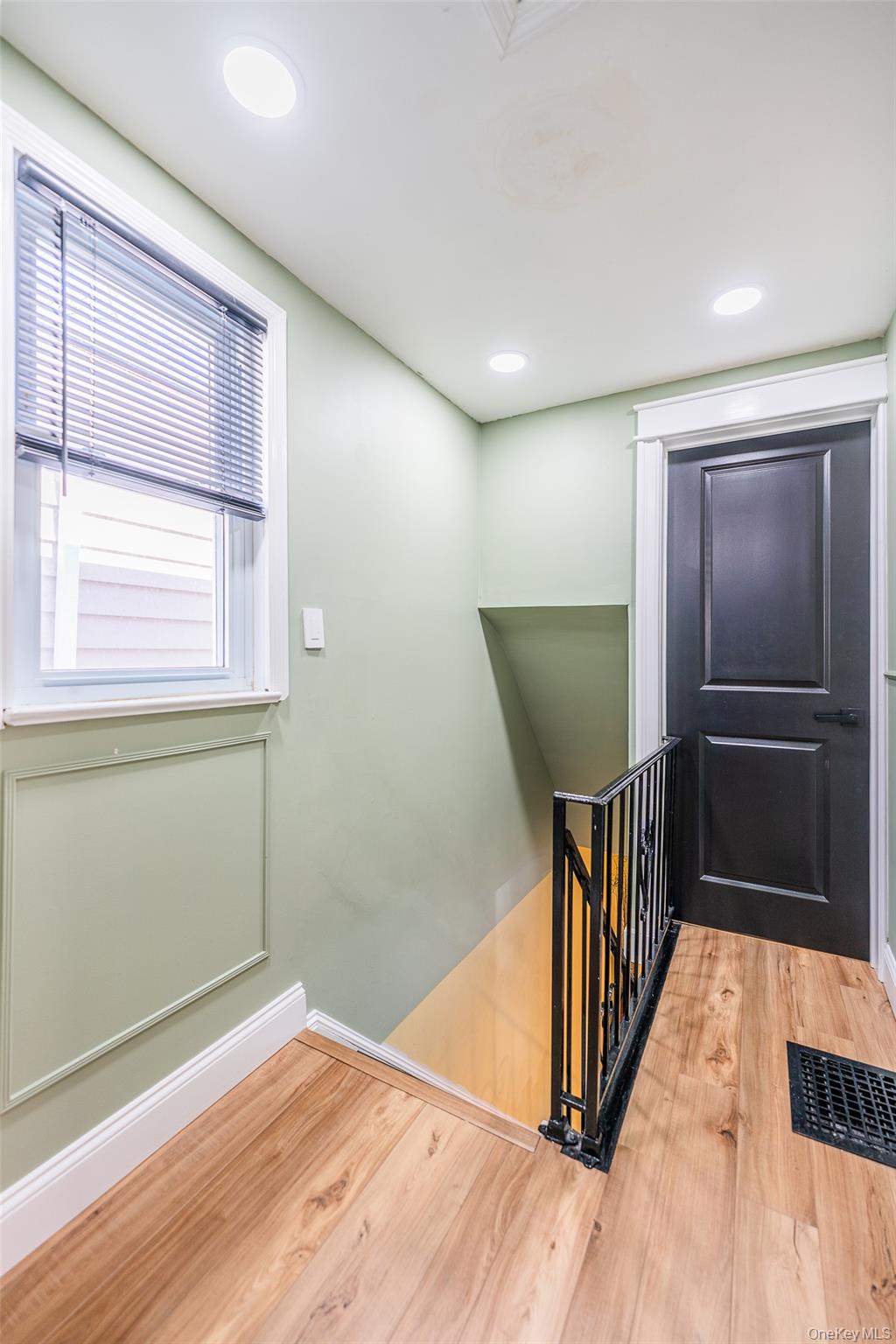 89-32 90th Street Queens, NY 11421 - Photo 12 of 33 Stairs featuring wood finished floors and recessed lighting