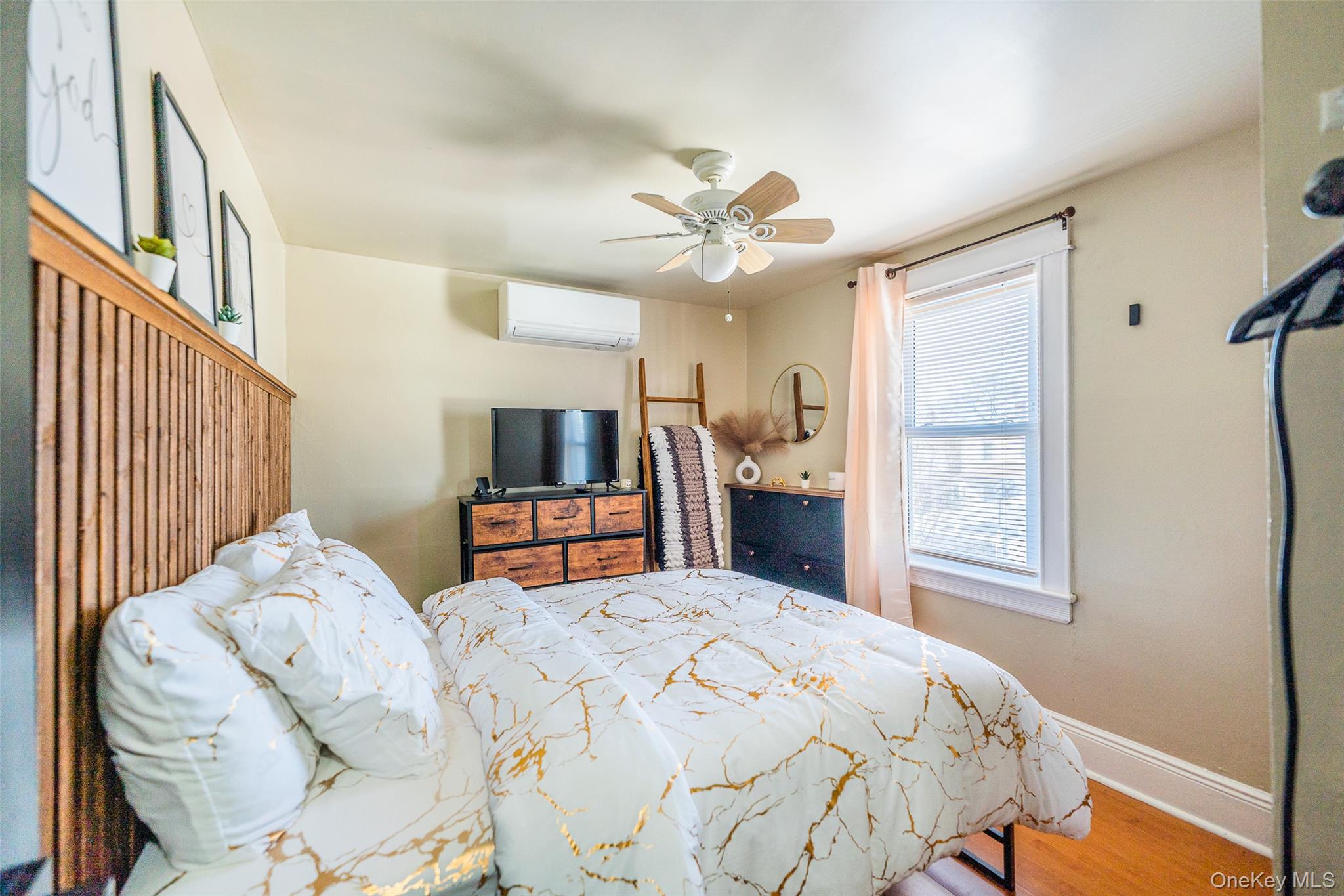 89-32 90th Street Queens, NY 11421 - Photo 14 of 33 Bedroom featuring a ceiling fan and light wood-style flooring