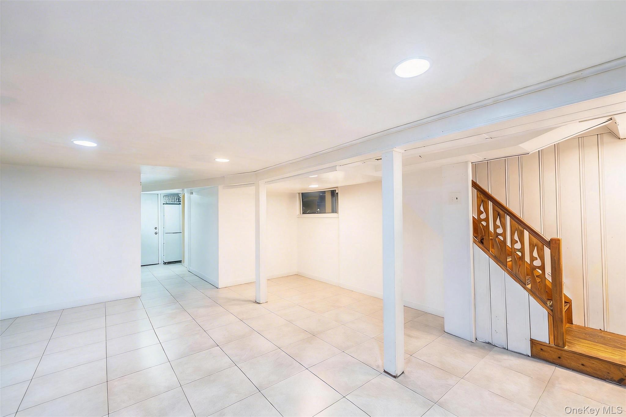 89-32 90th Street Queens, NY 11421 - Photo 19 of 33 Finished basement featuring recessed lighting and light tile patterned floors