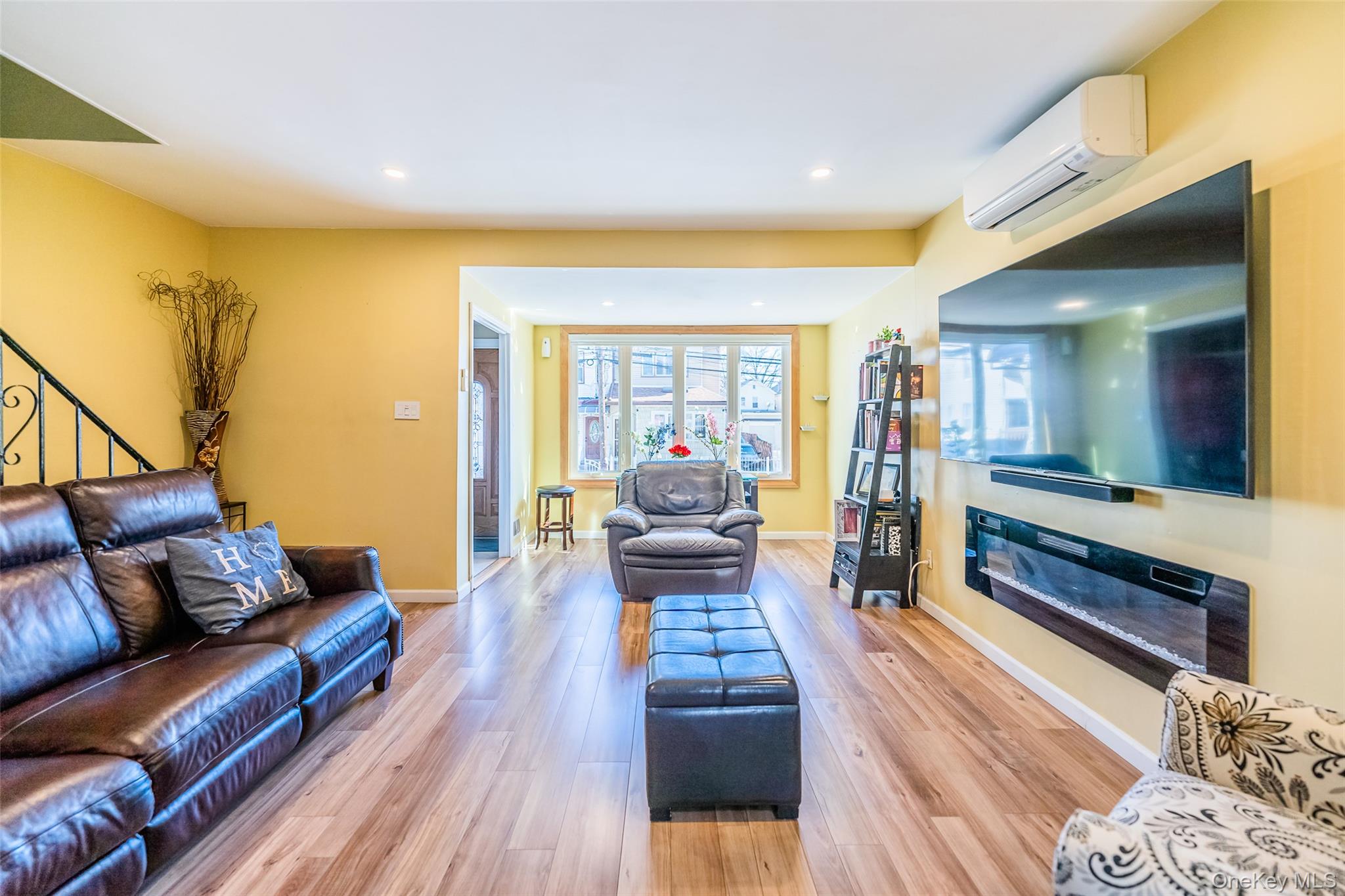 89-32 90th Street Queens, NY 11421 - Photo 6 of 33 Living room with light wood-style floors and recessed lighting
