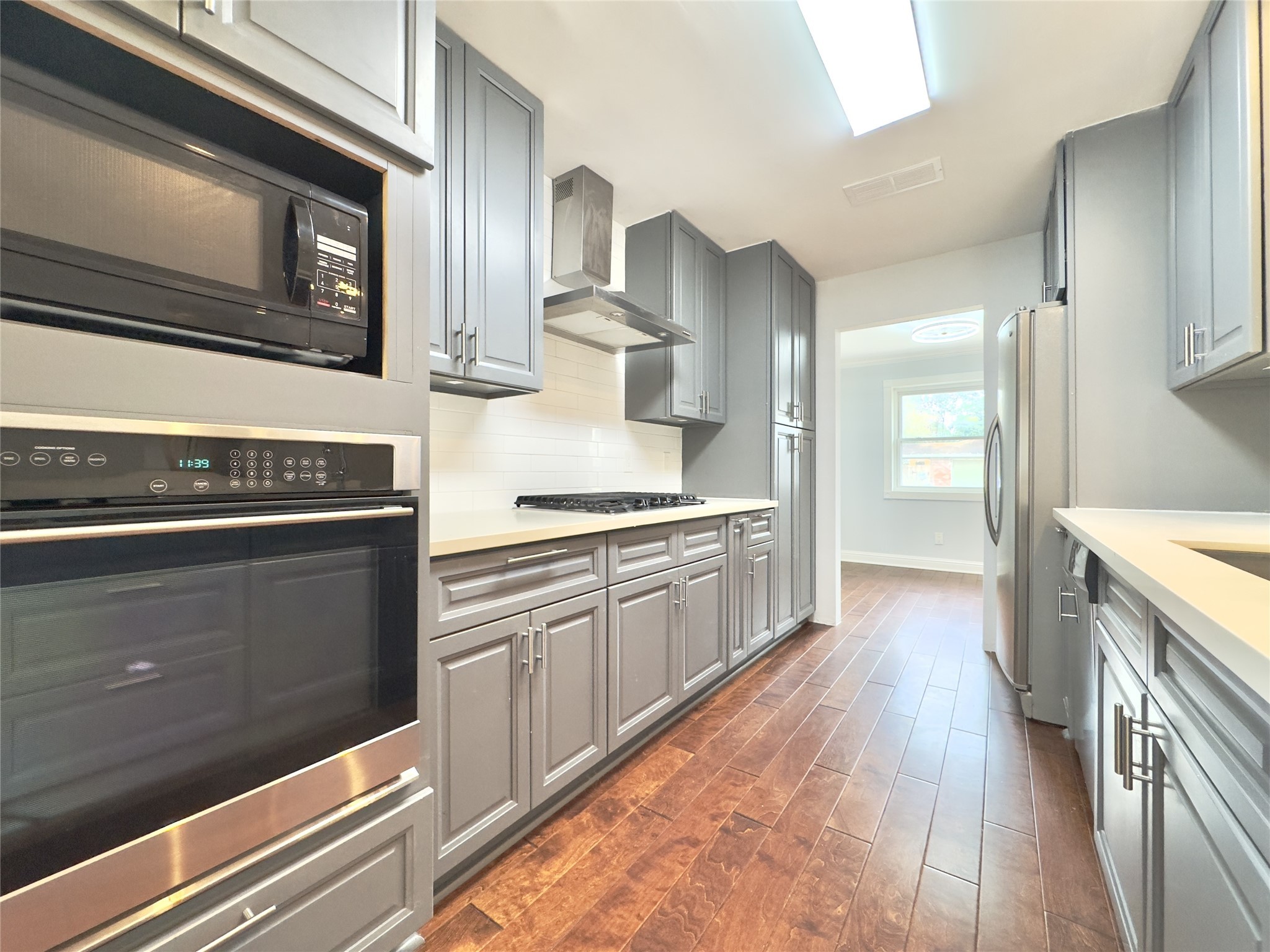 1415 Mapleton Drive Houston, TX 77043 - Photo 11 of 44 a kitchen with a stove oven and sink