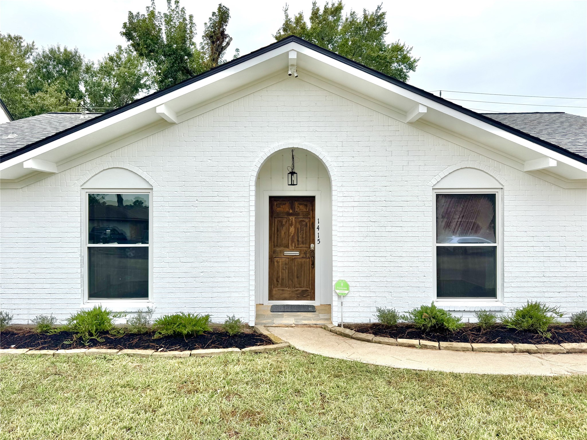 1415 Mapleton Drive Houston, TX 77043 - Photo 2 of 44 a front view of a house with garden