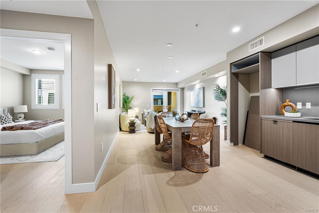 39 South Los Robles Avenue, Unit 6017 Pasadena, CA 91101 - Photo 6 of 22 a view of a dining area with furniture window and wooden floor