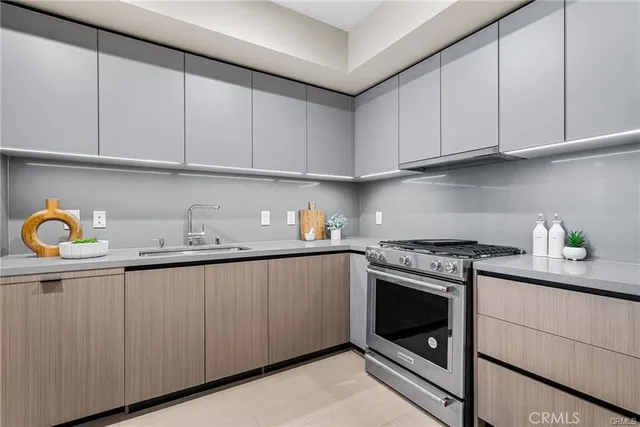 a kitchen with granite countertop cabinets stainless steel appliances and sink