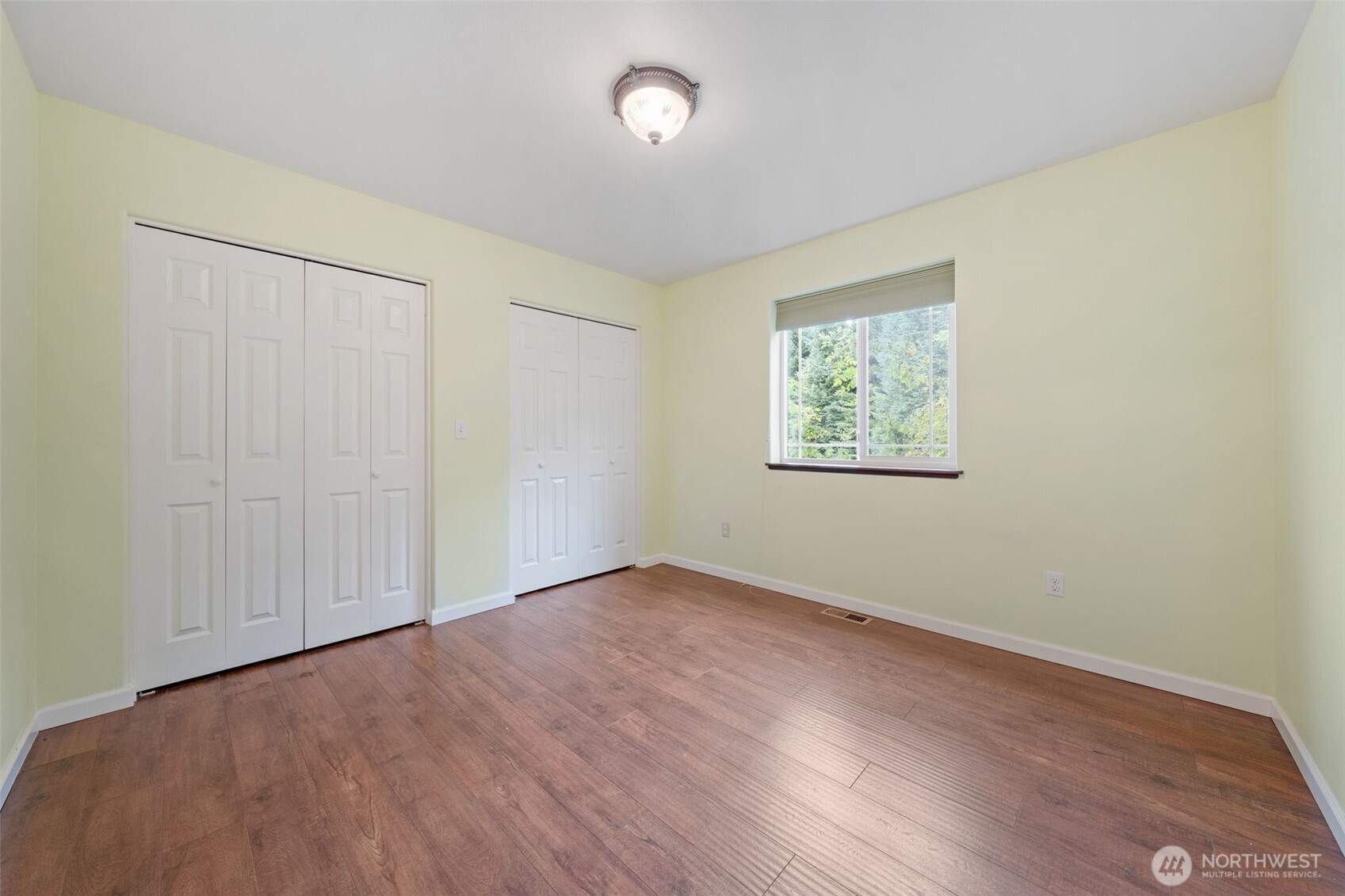 182-51 Burchett Road Onalaska, WA 98570 - Photo 18 of 29 an empty room with wooden floor and windows