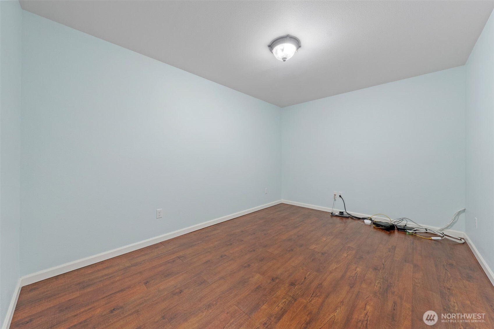 182-51 Burchett Road Onalaska, WA 98570 - Photo 19 of 29 a view of a room with wooden floor and white walls