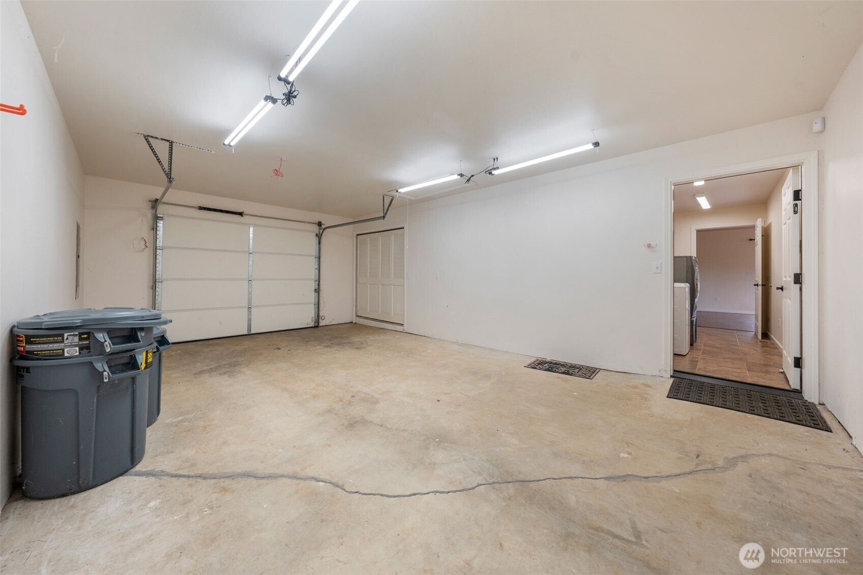 182-51 Burchett Road Onalaska, WA 98570 - Photo 21 of 29 an empty room with a empty space and wooden shelves