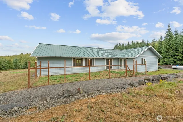 a house view with a backyard space