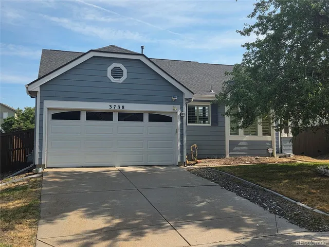 a front view of a house with a garage