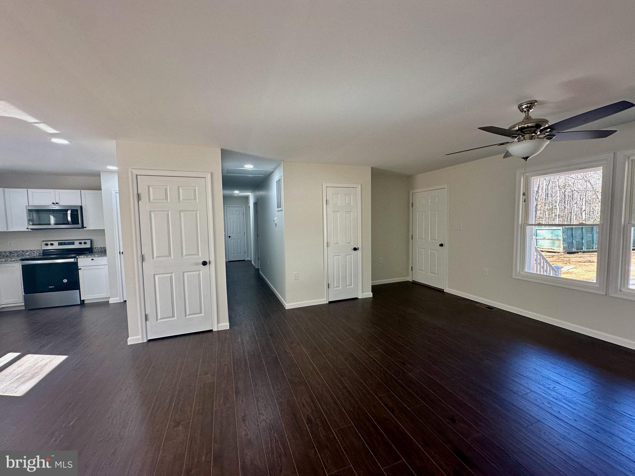 17094 Bel Pre Road Culpeper, VA 22701 - Photo 3 of 7 a view of an empty room with wooden floor and a window