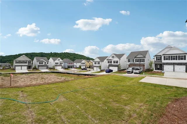 a swimming pool view with seating space