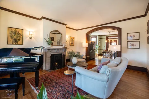 a living room with furniture and a fireplace
