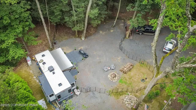 an aerial view of a backyard with fountain plants and trees