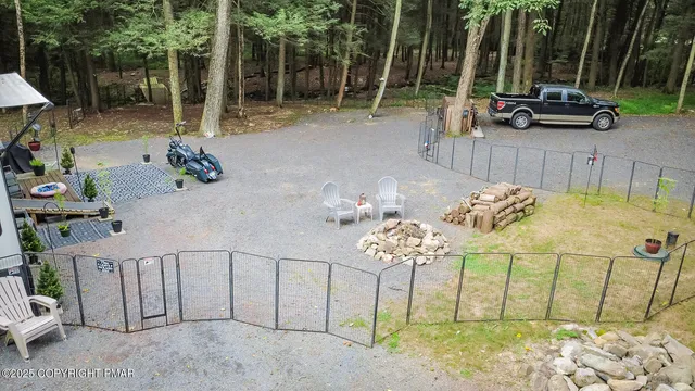 a backyard of a house with table and chairs