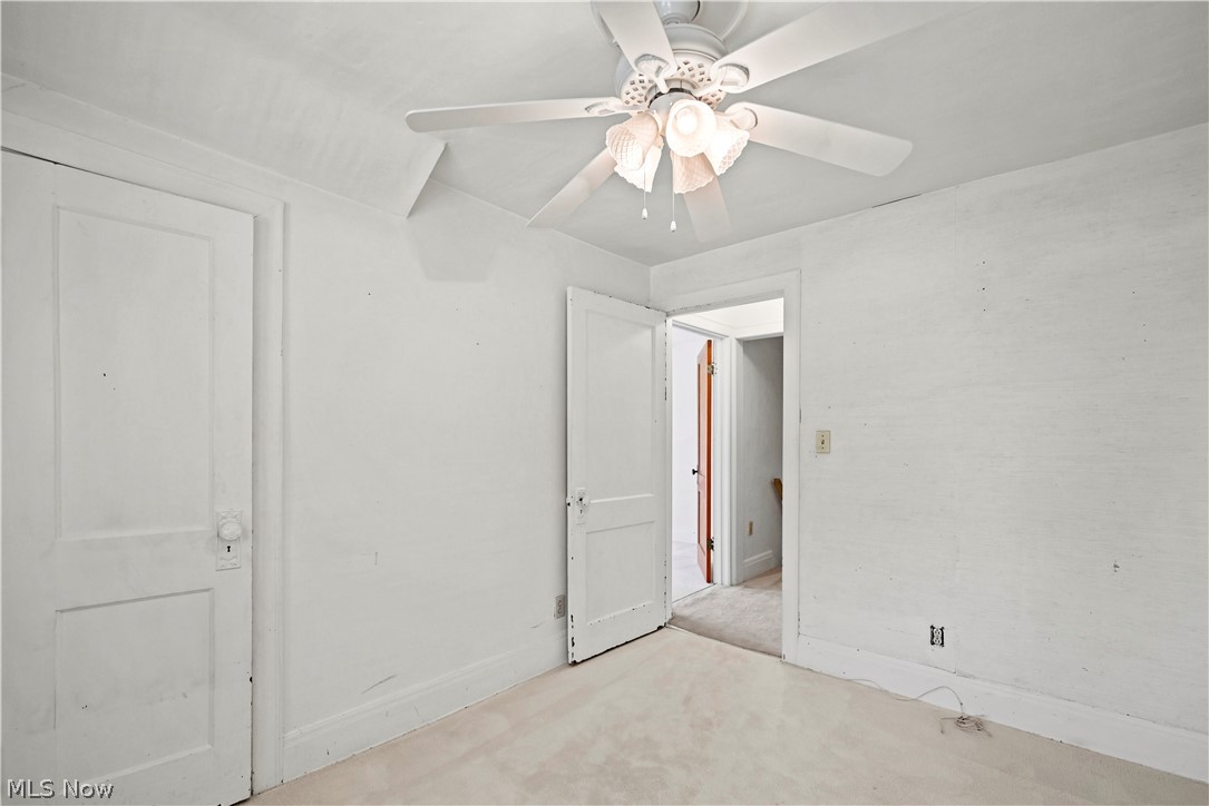 503 Ravenna Road Newton Falls, OH 44444 - Photo 17 of 34 Bedroom featuring a ceiling fan with integrated lighting, white painted walls, and carpet flooring